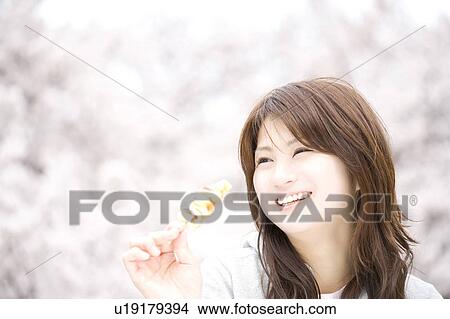 Picture - Cherry tree and woman. Fotosearch