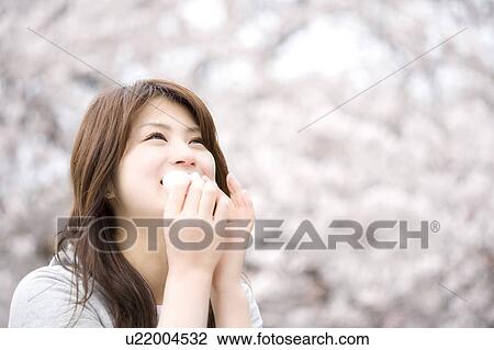 Stock Image - Cherry tree and woman. Fotosearch