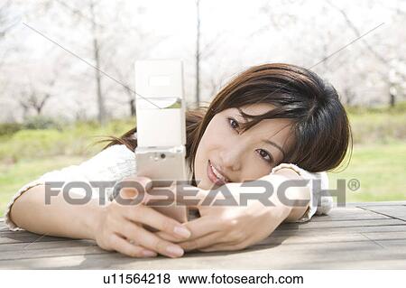 Stock Photo - Cherry tree and woman. Fotosearch