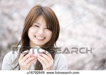 Stock Photo - Cherry tree and woman. Fotosearch