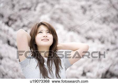 Stock Photo - Cherry tree and woman. Fotosearch