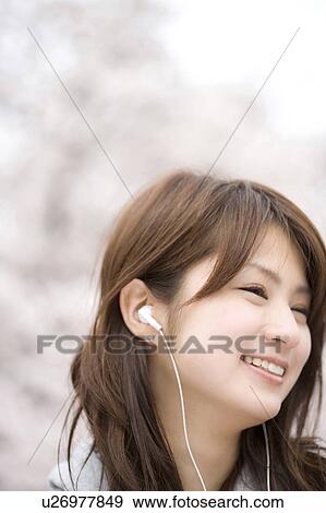 Stock Photo - Cherry tree and woman. Fotosearch