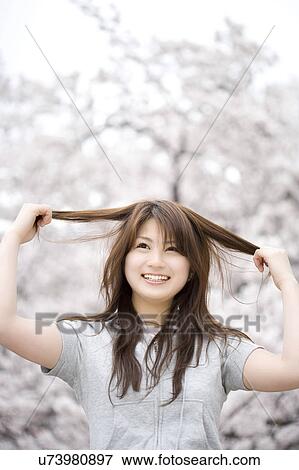 Stock Photo - Cherry tree and woman. Fotosearch