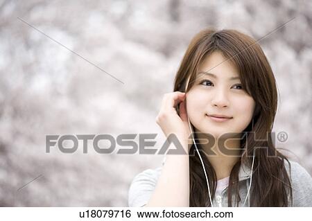 Stock Photograph - Cherry tree and woman. Fotosearch