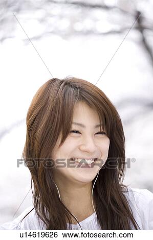 Stock Photograph - Woman under the cherry tree. Fotosearch