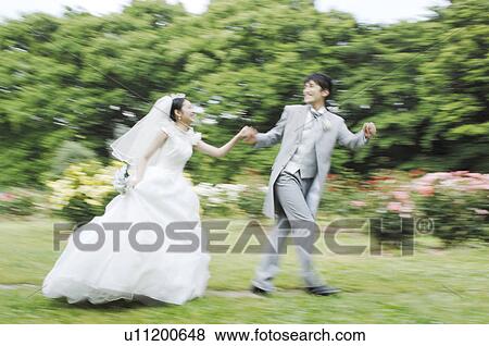Bride and bridegroom who runs View Large Photo Image Stock Photo - Bride and bridegroom who runs. Fotosearch