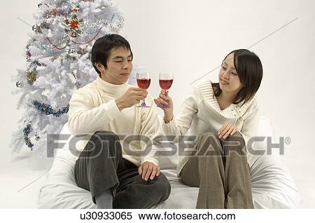 Couple toasting wine View Large Photo Image Stock Photography - Couple toasting wine. Fotosearch