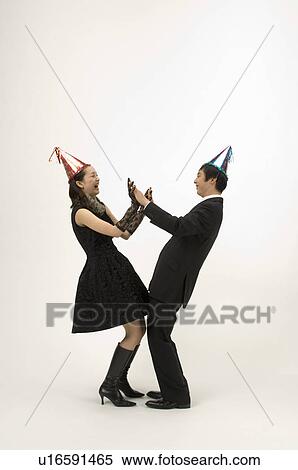 Couple wearing party hats View Large Photo Image Stock Photography - Couple wearing party hats. Fotosearch