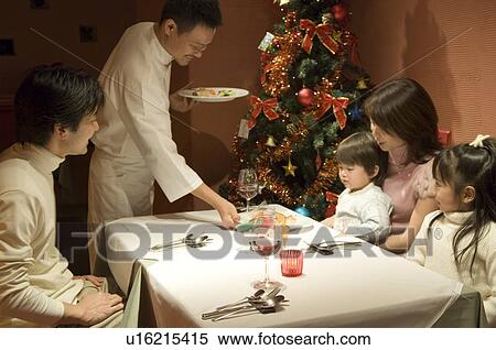 Stock Photography - Family having Christmas dinner. Fotosearch