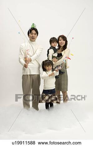 Family pulling crackers View Large Photo Image Stock Photo - Family pulling crackers. Fotosearch