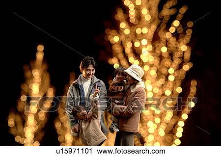 Stock Image - Family standing. Fotosearch