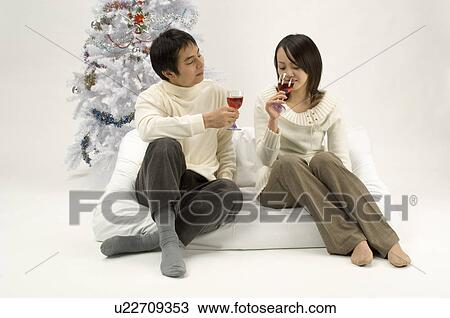 Couple toasting wine View Large Photo Image Stock Image - Couple toasting wine. Fotosearch