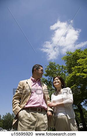 Stock Image - Mature couple walking. Fotosearch