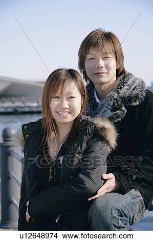 Picture - Portrait of young couple smiling. Fotosearch