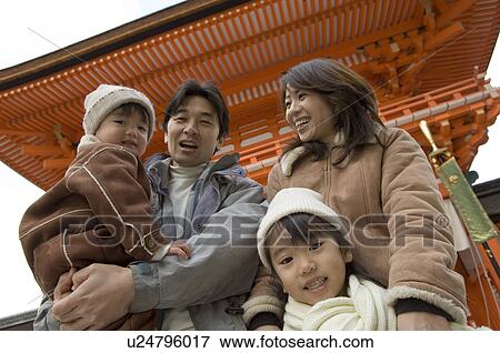 Family at shrine View Large Photo Image Stock Photo - Family at shrine. Fotosearch