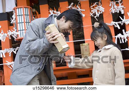 Stock Photograph - Family getting fortune paper. Fotosearch
