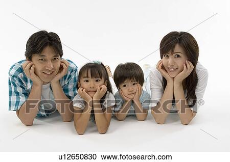 Family lying on front View Large Photo Image Stock Image - Family lying on front. Fotosearch
