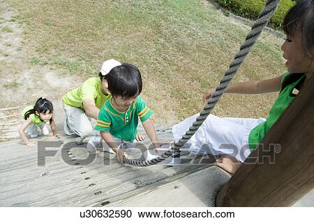 Family playing in playground View Large Photo Image Stock Image - Family playing in playground. Fotosearch