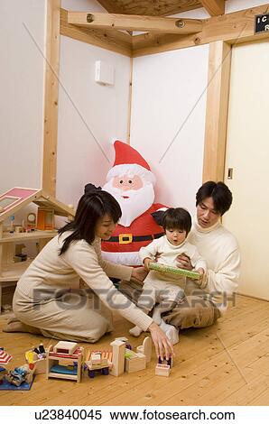 Stock Photography - Family playing with toys. Fotosearch