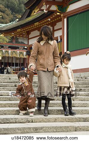 Stock Photography - Family walking down stairs. Fotosearch