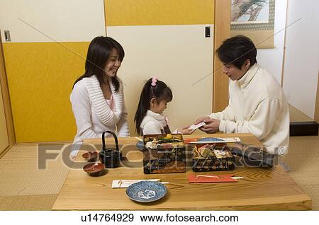 Stock Photo - Father giving daughter some money. Fotosearch