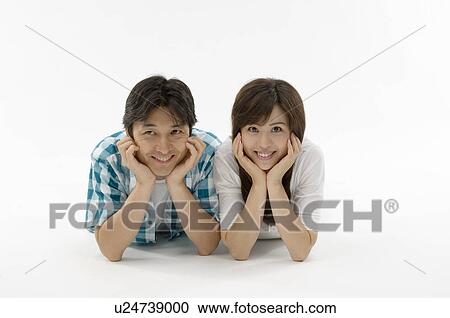 Husband and wife lying on front View Large Photo Image Stock Image - Husband and wife lying on front. Fotosearch