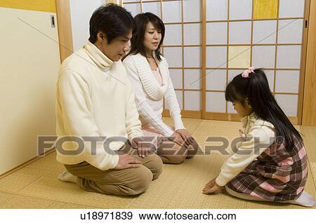 Parents and daughter sitting View Large Photo Image Stock Photo - Parents and daughter sitting. Fotosearch
