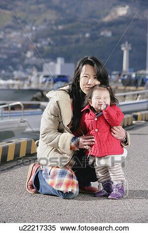 Stock Photography - Portrait of mother and daughter. Fotosearch