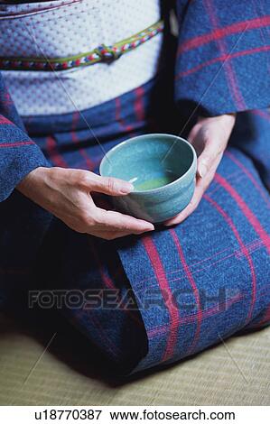 A mature woman holding a tea cup View Large Photo Image Stock Photo - A mature woman holding a tea cup. Fotosearch