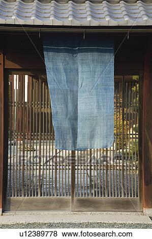 Stock Photo - Cloth hanging outside lattice door. Fotosearch