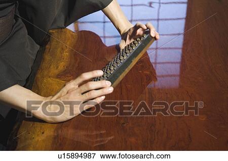 Stock Photo - Man calculating with abacus. Fotosearch
