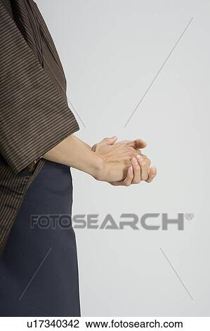 Man rubbing his hands together View Large Photo Image Stock Image - Man rubbing his hands together. Fotosearch