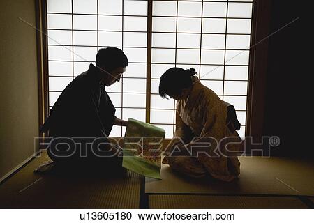 Man showing woman fabric for kimono View Large Photo Image Stock Image - Man showing woman fabric for kimono. Fotosearch