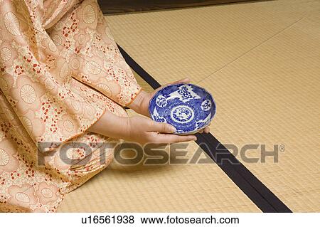 Stock Photo - Woman examining plate. Fotosearch