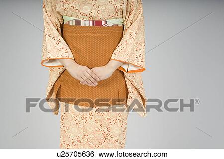 Woman wearing kimono with apron View Large Photo Image Stock Photograph - Woman wearing kimono with apron. Fotosearch
