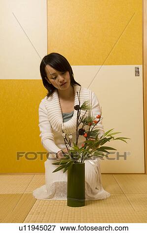 Stock Photo - Young woman and New Year decoration. Fotosearch