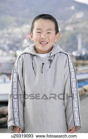 Stock Image - Portrait of a boy standing. Fotosearch