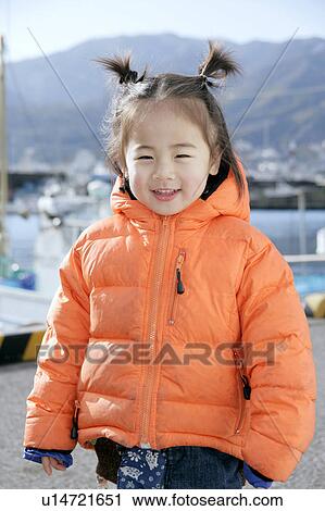 Stock Image - Portrait of a girl smiling. Fotosearch
