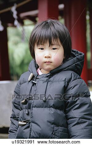 Stock Image - Portrait of a girl standing. Fotosearch