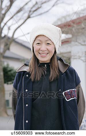 Stock Image - Portrait of a mid adult woman. Fotosearch