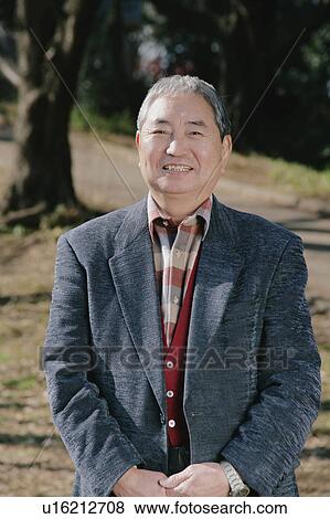 Portrait of a senior man standing View Large Photo Image Stock Photo - Portrait of a senior man standing. Fotosearch