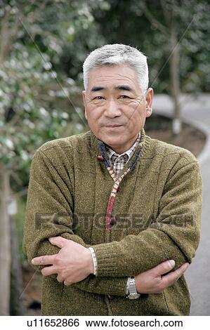Stock Photograph - Portrait of a senior man standing. Fotosearch
