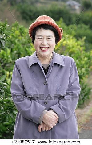 Portrait of a senior woman smiling View Large Photo Image Stock Photo - Portrait of a senior woman smiling. Fotosearch