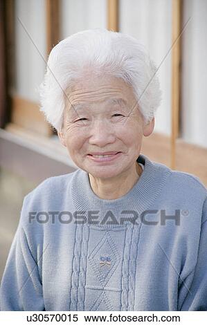 Portrait of a senior woman smiling View Large Photo Image Stock Photography - Portrait of a senior woman smiling. Fotosearch
