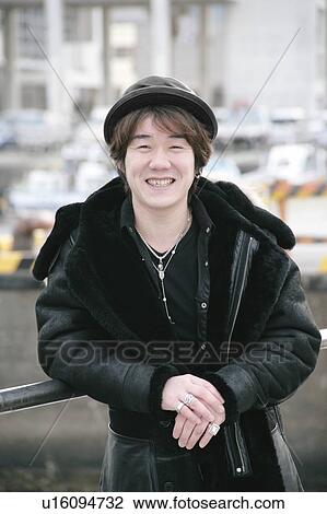 Portrait of a young man smiling View Large Photo Image Stock Image - Portrait of a young man smiling. Fotosearch