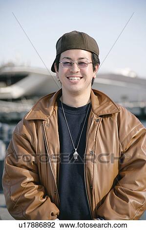 Portrait of a young man smiling View Large Photo Image Stock Image - Portrait of a young man smiling. Fotosearch