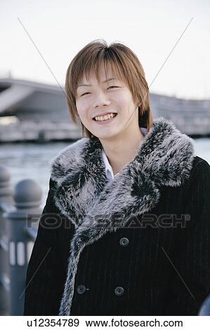 Stock Photo - Portrait of a young man smiling. Fotosearch