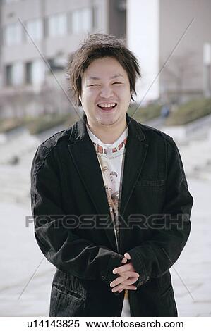 Stock Photography - Portrait of a young man smiling. Fotosearch