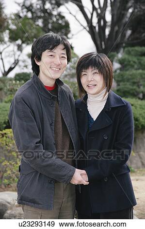 Stock Photo - Portrait of mid adult couple. Fotosearch
