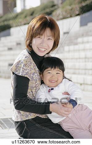 Stock Image - Portrait of mother and daughter. Fotosearch